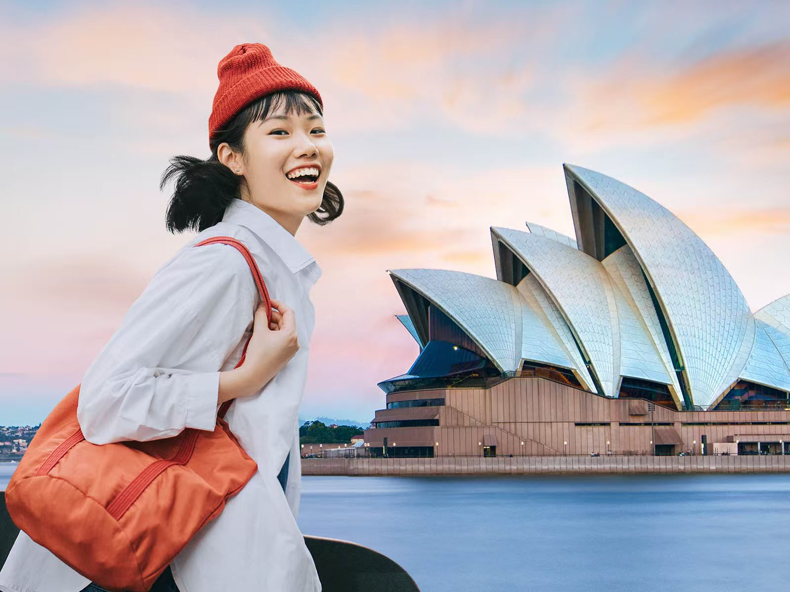Picture of a smiling student overlaid with the words 'Stop worrying about interviews, start planning for future abroad'